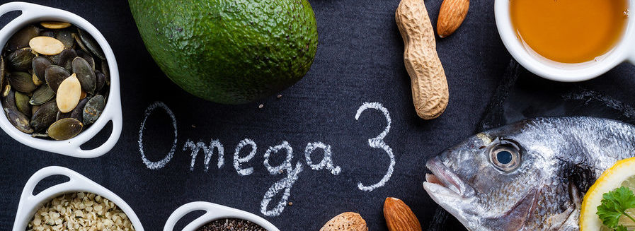Omega-3 rich foods on a black surface