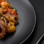 beef stew dish on lack background