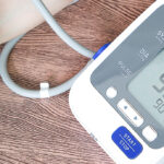 blood pressure monitor on wooden table